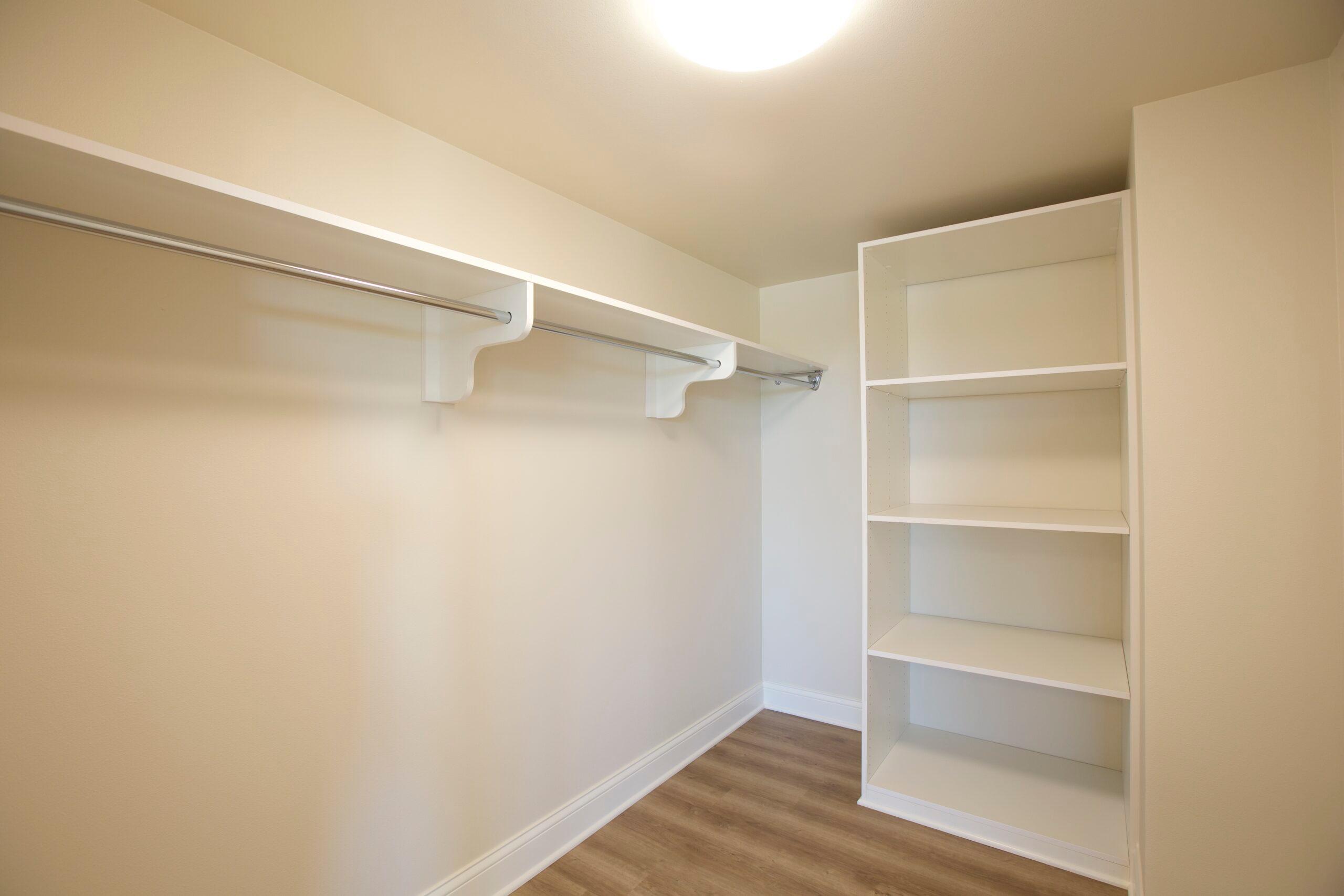 Image of a closet with shelves and space to hang clothes.