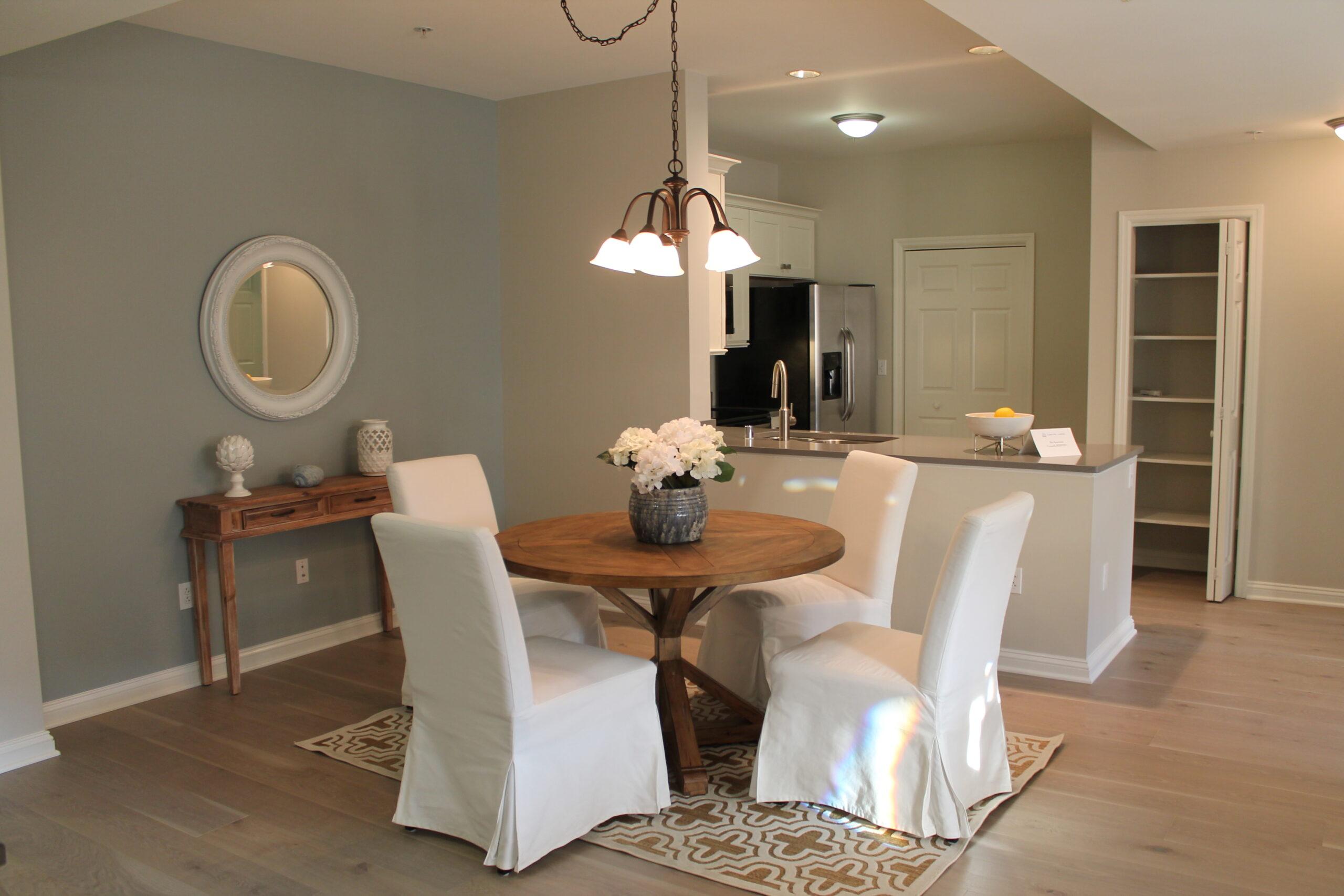 A kitchen and living space in the Reno floor plan.