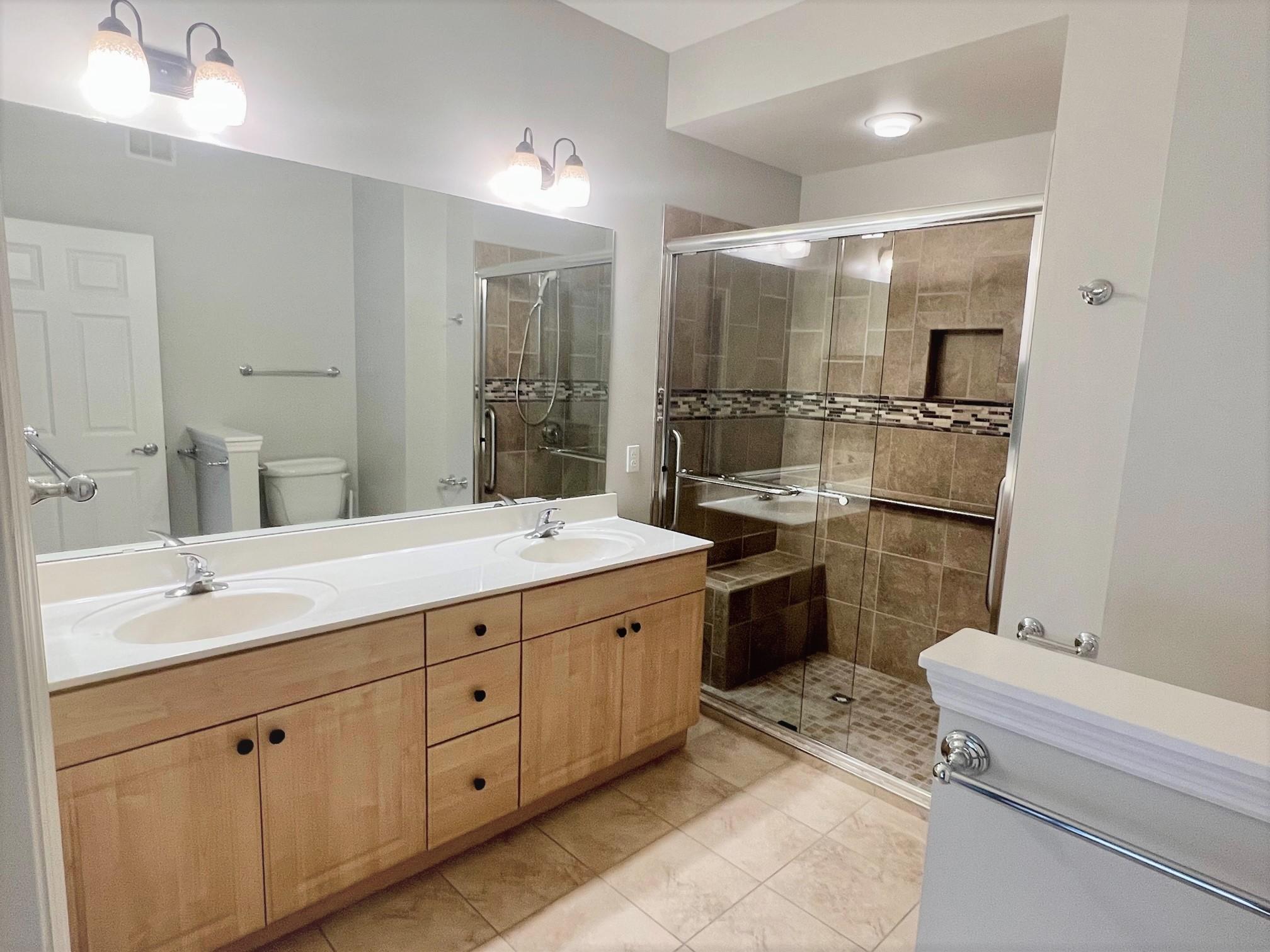 A bathroom with two sinks in the Reno floor plan.