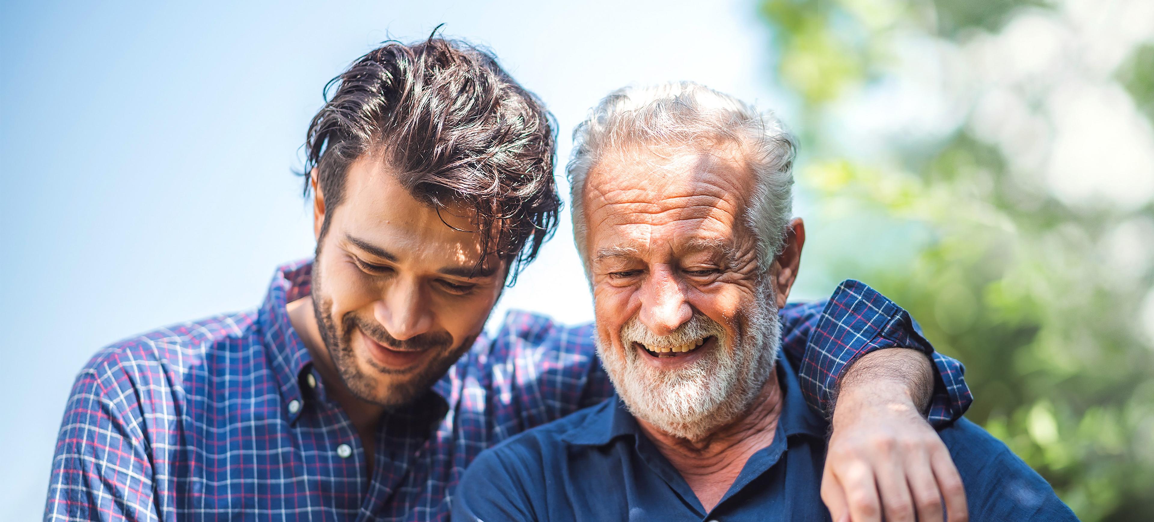 Adult hipster son fun hugging old senior father at home, two generations have a beard talking together and relaxing with smile, 2 man happy enjoy to living at home in father's day with love of family