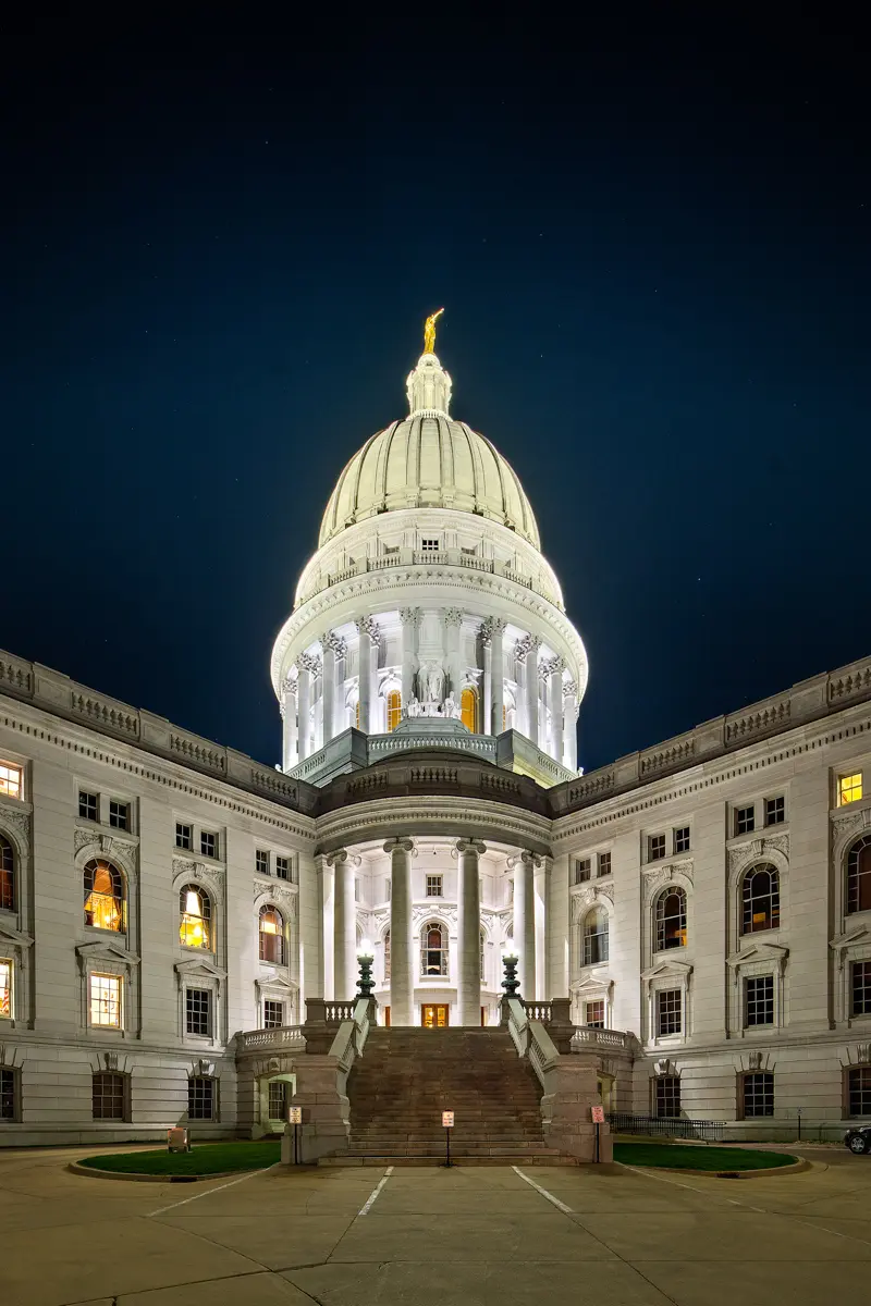 Exterior shot of Capitol Lakes at night, which is lit up from the inside.