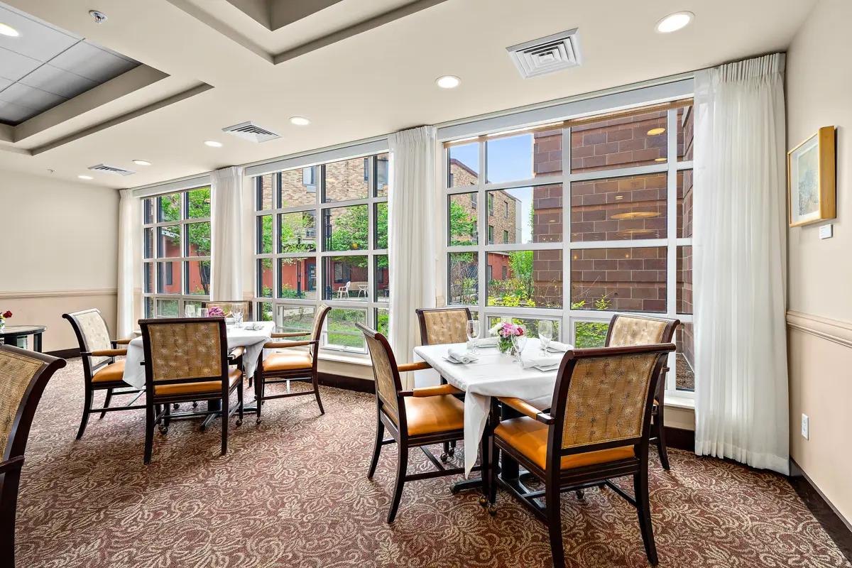 A dining area in Capitol Lakes, which is filled with large windows.
