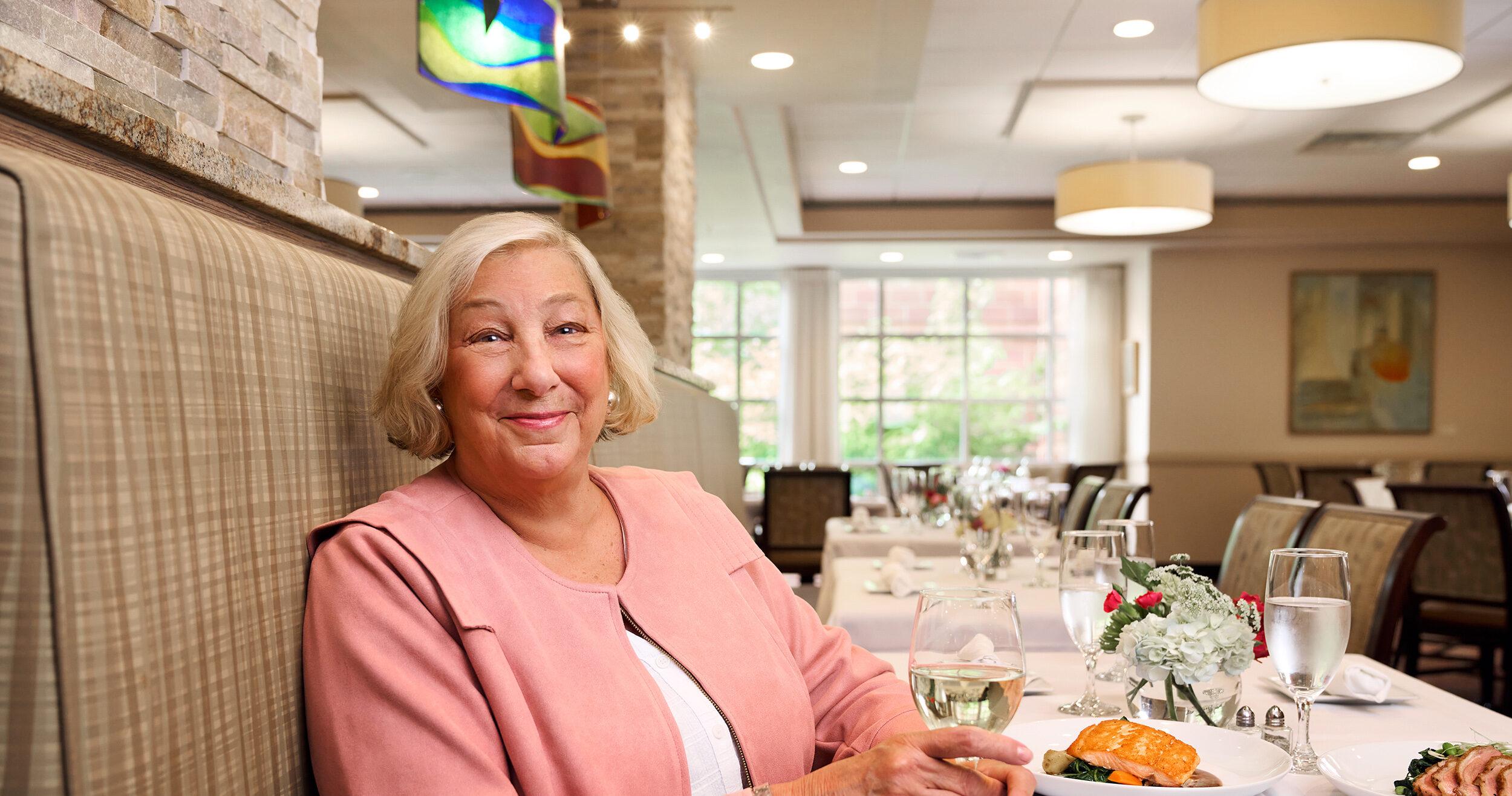 Close-up portrait of Capitol Lakes resident Lynda in a dining area.